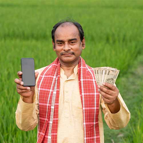 Man holding a mobile phone and cash bills